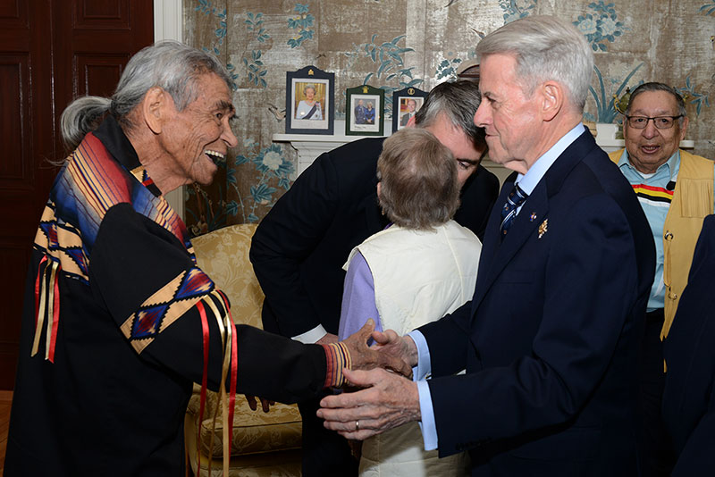 Elder Doug Knockwood and Lt.-Gov. J.J. Grant shake hands.